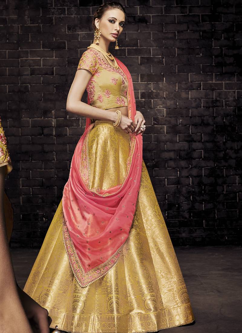 yellow embroidered brocade semi stitched bridal lehengas - Vasu Sarees ...