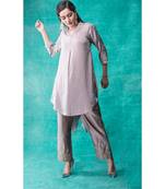 Show Shaa High low fabric manipulated kurta waccompanied byembroided  golden birds on pants.