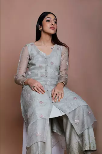Show Shaa Sea green Chnaderi FLORAL SHEER OVERALL WITH GEOMETRICAL Stripe tunic and embroided pants.