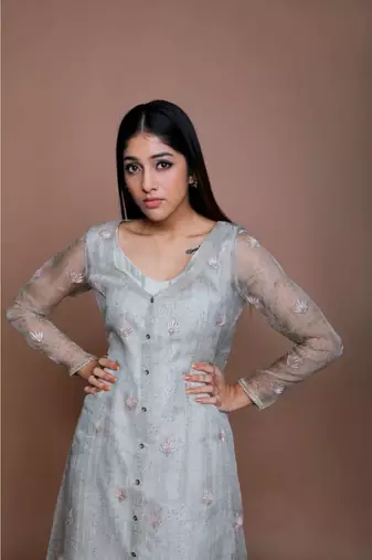 Show Shaa Sea green Chnaderi FLORAL SHEER OVERALL WITH GEOMETRICAL Stripe tunic and embroided pants.