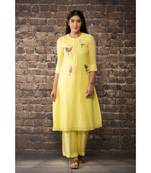 sulochana jangir yellow handloom linen twill kurta with 5 flower hand embroidery paired with matching pants.