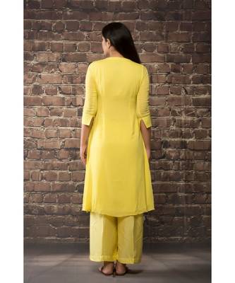 sulochana jangir yellow linen georgette kurta with geeth work paired with matching pants. 2
