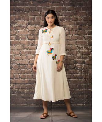 sulochana jangir white linen georgette  dress with aari work. 1