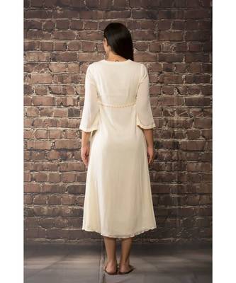 sulochana jangir white linen georgette  dress with aari work. 2