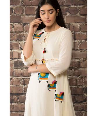 sulochana jangir white linen georgette  dress with aari work. 3
