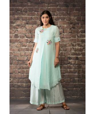 sulochana jangir ice blue handloom linen twillkurta with 3 flower hand embroidery paired with maching pants. 1