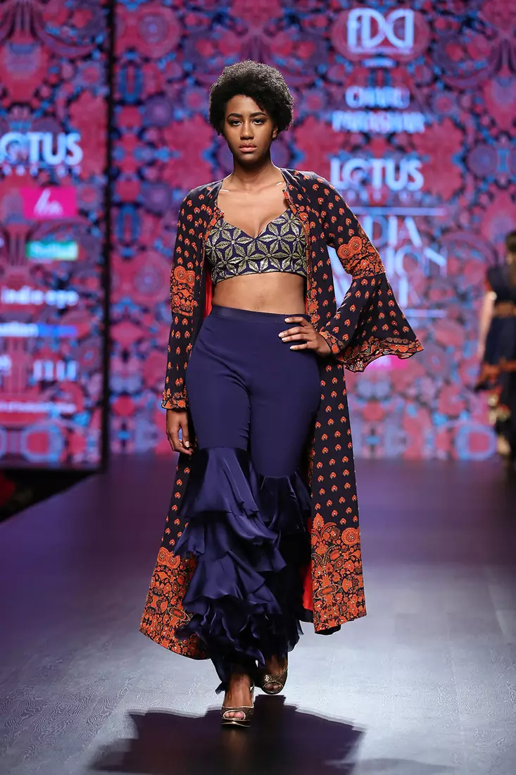 Charu Parashar Navy blue printed front open long cape with hand embellished blouse and flare pants