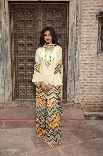 Cream Printed Kurta With Printed Sharara And Dupatta