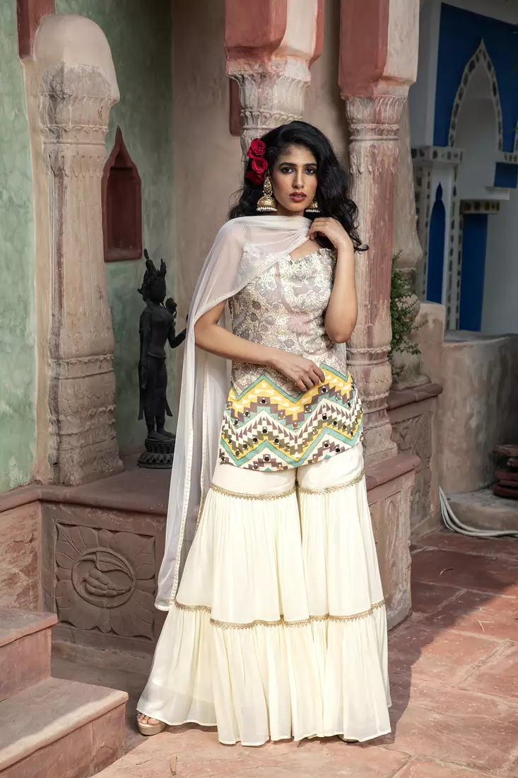 Charu parashar Cream printed sleveless kurta with sharara and dupatta