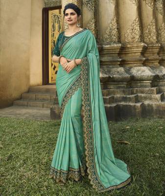 Turquoise embroidered silk blend saree with blouse 1