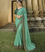 Turquoise embroidered silk blend saree with blouse