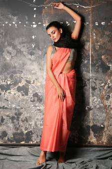 Peach woven silk blend saree with blouse