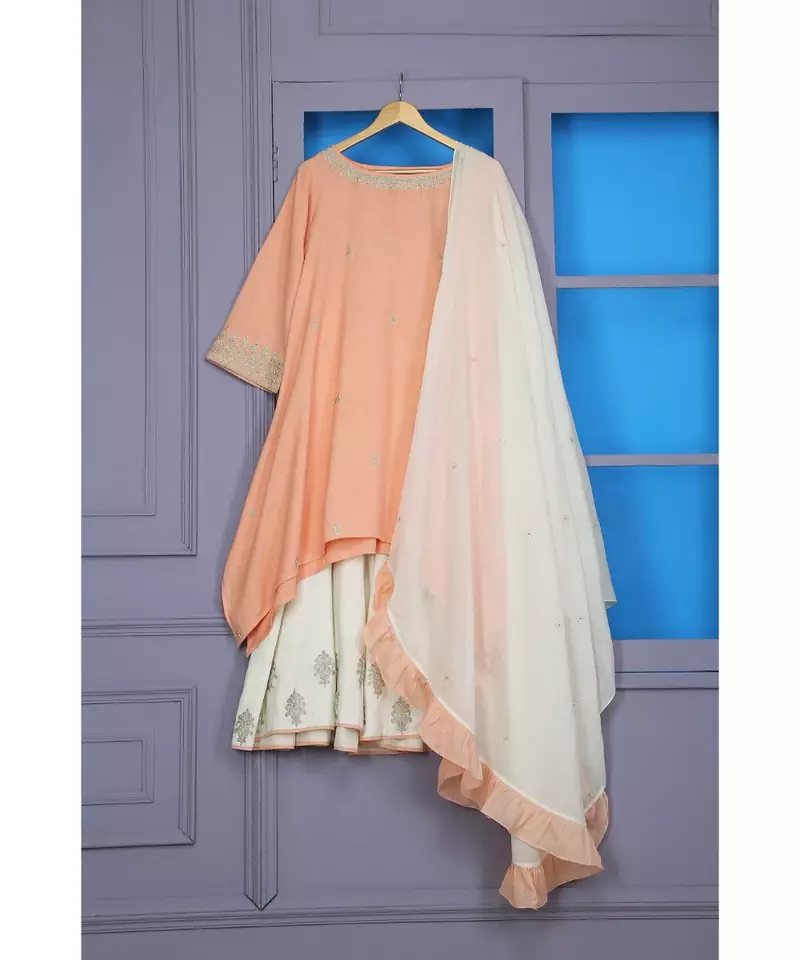 ANJU HARLEEN PEACH ASSYMETRICAL TUNIC WITH IVORY SHARARA AND DUPATTA