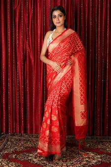 Red woven silk blend
 saree with blouse