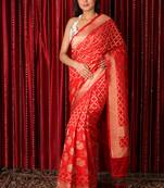 Red woven silk blend
 saree with blouse