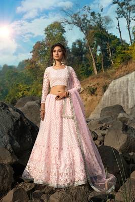 CAPTIVATING LIGHT PINK SEQUINS, ZARI, AND THREAD EMBROIDERY NET SEMI STITCHED WEDDING LEHENGA 1