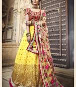 YELLOW & RED ZARI, SEQUINS AND THREAD EMBROIDERED NET SEMI STITCHED WEDDING LEHENGA