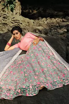 Pleasant Grey Sequins Zari And Thread Embroidery Net Semi Stitched Wedding Lehenga