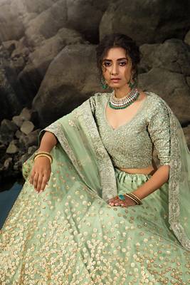 Seductive Green Dori And Sequins Embroidered Net Lehenga Choli For Bride 4