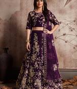 Purple embroidered velvet semi stitched lehenga