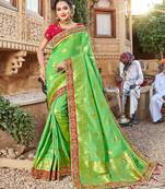 Green embroidered silk blend saree with blouse