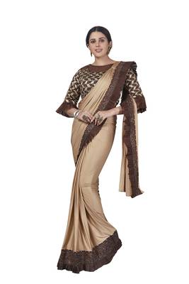 Beige brasso lycra saree with blouse 2