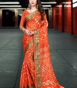 Orange woven chiffon saree with blouse