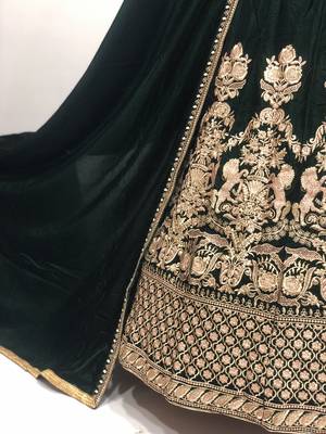Green embroidered velvet semi stitched lehenga 3