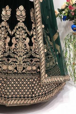 Green embroidered velvet semi stitched lehenga 4