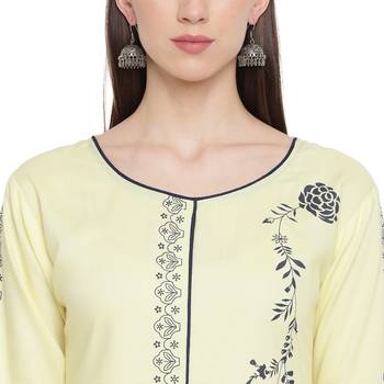 Yellow printed rayon kurtas-and-kurtis 5