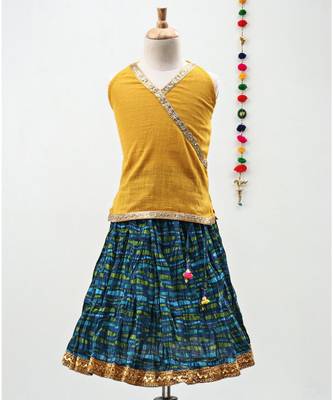Green and Yellow cotton Lehenga with a Halter neck choli and a golden lace 1