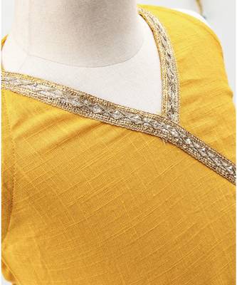 Green and Yellow cotton Lehenga with a Halter neck choli and a golden lace 6