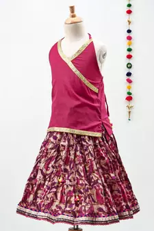 Pink cotton Paisley printed Lehenga with a halter neck choli and golden lace