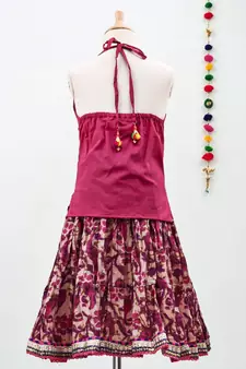 Pink cotton Paisley printed Lehenga with a halter neck choli and golden lace