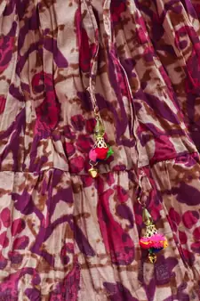 Pink cotton Paisley printed Lehenga with a halter neck choli and golden lace