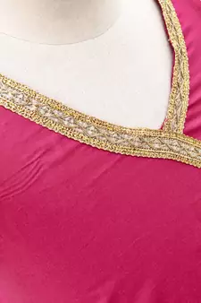 Pink cotton Paisley printed Lehenga with a halter neck choli and golden lace