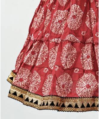 red and black cotton printed lehenga with a contrast choli and a golden lace 5