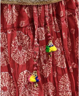 red and black cotton printed lehenga with a contrast choli and a golden lace 6