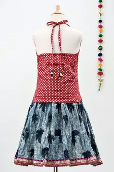 blue and red cotton leaf printed lehenga with a contrast choli and golden lace
