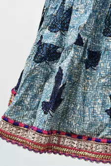 blue and red cotton leaf printed lehenga with a contrast choli and golden lace