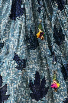 blue and red cotton leaf printed lehenga with a contrast choli and golden lace