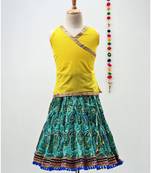 green and yellow cotton lehenga with a contrast  halter neck choli and a golden lace
