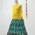 green and yellow cotton lehenga with a contrast  halter neck choli and a golden lace
