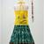 green and yellow cotton lehenga with a contrast  halter neck choli and a golden lace