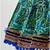 green and yellow cotton lehenga with a contrast  halter neck choli and a golden lace