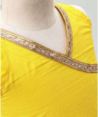 green and yellow cotton lehenga with a contrast  halter neck choli and a golden lace 5