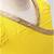 green and yellow cotton lehenga with a contrast  halter neck choli and a golden lace