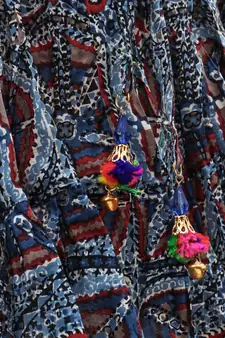 blue and red cotton printed lehenga with a contrast self print halter neck choli and a gold lace