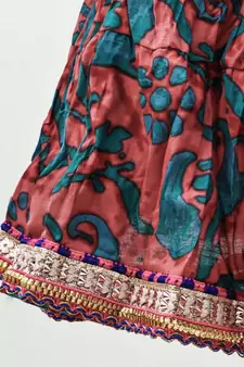 multicolor cotton printed Lehenga with a contrast halter neck choli and a lovely golden  lace