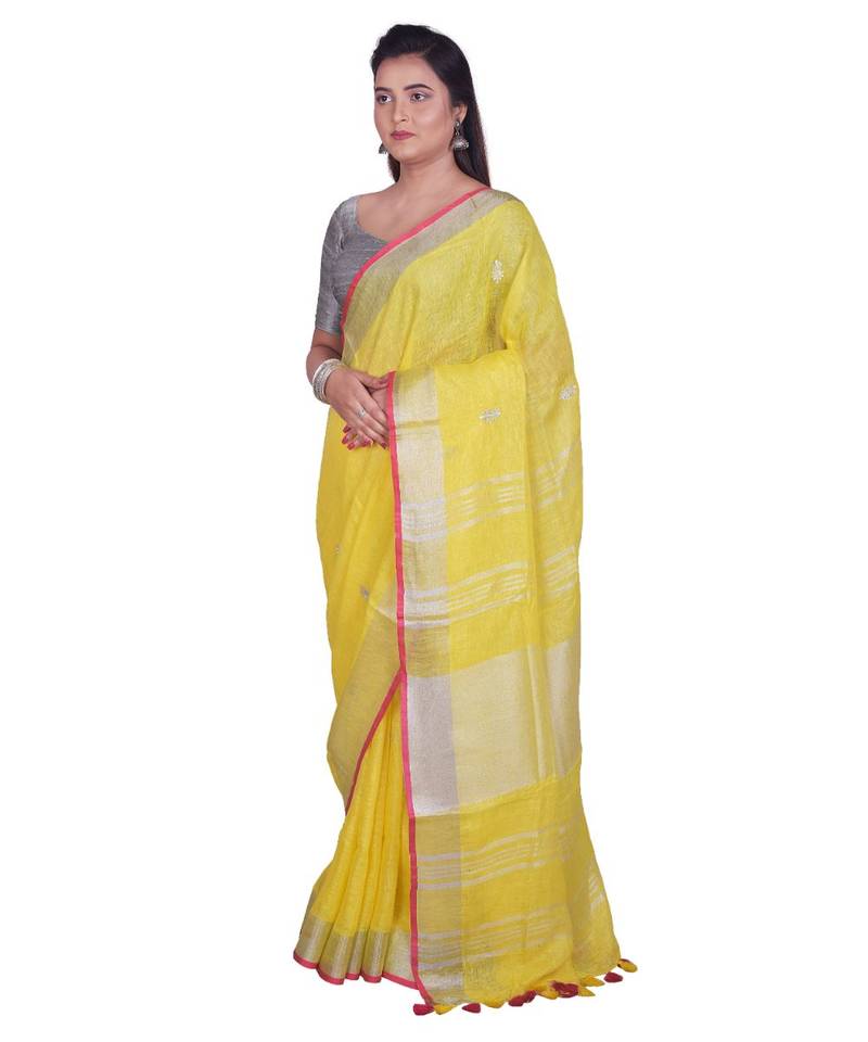 Handcrafted Yellow Linen saree with Silver zari border and beautiful embroidery work